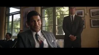 man in suit pointing at camera — Ford v Ferrari