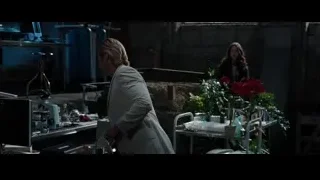 man and woman in dimly lit brick room — Iron Man 3