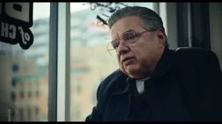 man by window with city skyline — The Bear