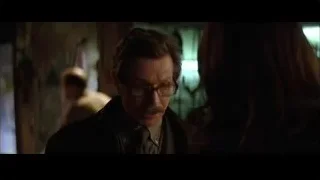 man and woman in dimly lit room — Batman