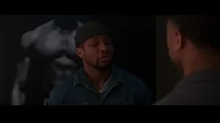 two men in dimly lit room — Creed 3