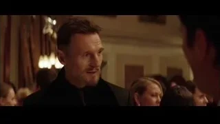man in suit looking at camera in crowded room — Batman
