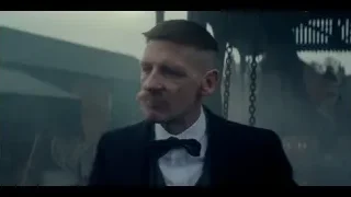 man in suit in front of smoky building — Peaky Blinders