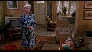 elderly woman in floral dress in living room — Spider Man