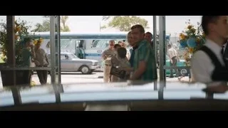 people standing in front of bus — Ford v Ferrari