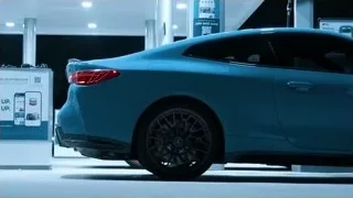 blue sports car in parking garage — Sports Cars