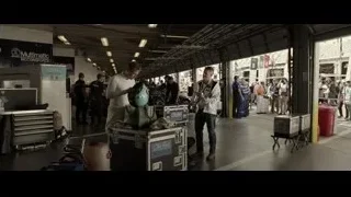 Two men working with tools in garage — F1