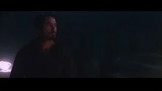 man holding flashlight in dark room — Iron Man