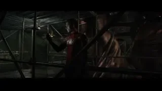 Masked man with gun near dragon statue — Spiderman: No Way Home