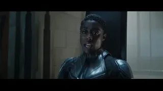 woman in futuristic suit in dimly lit room — Doctor Strange 2