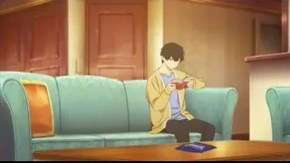 young man reading book on blue couch — I Want To Eat Your Pancreas