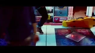 boy at colorful arcade machine — The Karate Kid