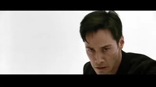 man in suit walking against white background — The Matrix