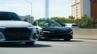 black sports car driving at night — Sports Cars
