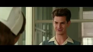 young man standing by window with blinds — Hacksaw Ridge