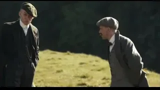 three men talking in a field — Peaky Blinders