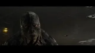 Creature close-up with red eyes and sharp teeth — The Amazing Spider Man