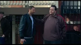men on street by brick building — The Bear