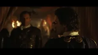 two men in military uniforms in dimly lit room — Gladiator