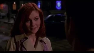woman talking to man on street — Spider Man