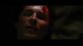 Man's bloody face in dark setting — Batman: The Dark Knight Rises