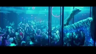 Person dancing in vibrant nightclub crowd — John Wick