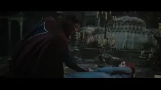 man comforting woman in dimly lit room — Doctor Strange 2