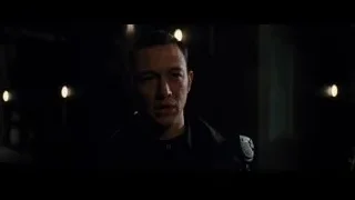 man with serious expression in dark room — Batman: The Dark Knight Rises