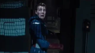 Person in blue suit holding gun — The Avengers