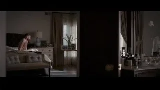 shirtless man sitting on couch in bedroom — Southpaw