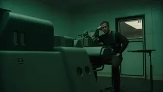 Man with gun in dark control room — Blade Runner 2049