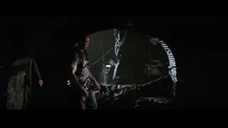 Men walking through dark tunnel with flashlight — Batman