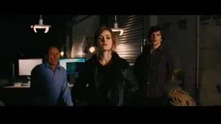 Red-haired woman and men in dimly lit room — Now You See Me