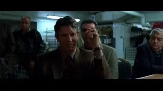 man in suit deep in thought in room with pipes — Batman: The Dark Knight