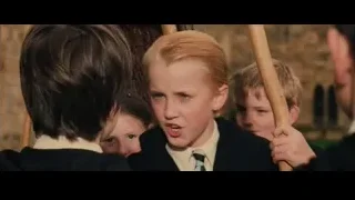 Blonde boy with stick in classroom — Harry Potter and the Philosophers Stone