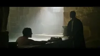 shirtless man reading book by window — Gladiator 2