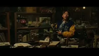 man in yellow jacket holding gun in workshop — Spiderman: No Way Home