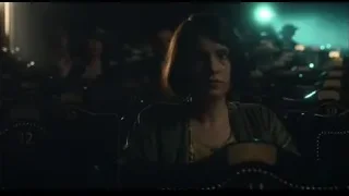 man and woman in dimly lit movie theater — Peaky Blinders