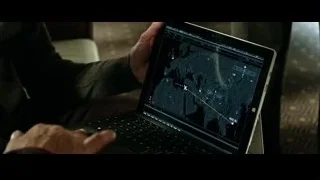 person holding laptop with world map — Now You See Me 2