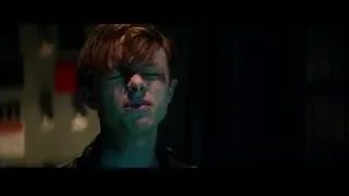 young man's bloody face in dark room — The Amazing Spider Man 2