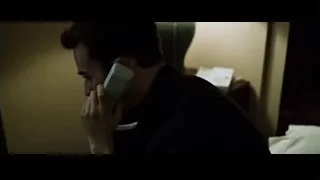Man on bed talking on phone in dim room — Fight Club