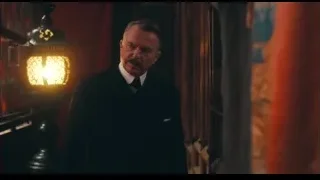 man in suit in dimly lit room — Peaky Blinders
