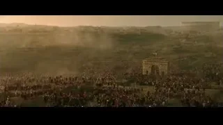 Large crowd around archway with statue — Gladiator 2