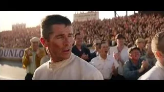 man speaking to large crowd — Ford v Ferrari