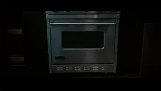 Person cleaning oven with yellow gloves — Limitless