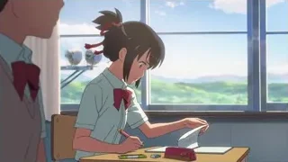 Girl writing at desk by window — Your Name