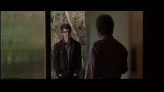 Two men near window, one in purple jacket — The Amazing Spider Man