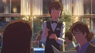 Young man in tuxedo holding phone in restaurant — Your Name
