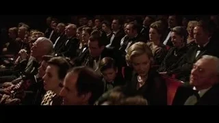 people listening attentively in theater — Batman