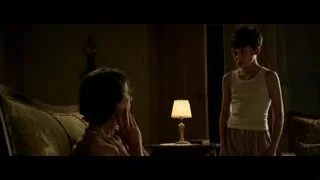 mother and son on couch looking at tablet — Hacksaw Ridge